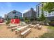 Outdoor area features community tables and seating near modern buildings, perfect for social gatherings and events at 1010 Nicholwood Dr # 301, Raleigh, NC 27605