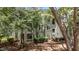 Exterior of condo building surrounded by mature shade trees and lush, green landscaping at 1010 Nicholwood Dr # 301, Raleigh, NC 27605