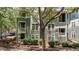 Exterior of condo building, showcasing unit number and surrounding greenery with mature trees at 1010 Nicholwood Dr # 301, Raleigh, NC 27605