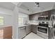 Modern kitchen boasts stainless steel appliances, granite countertops, and seamless flow into the living space at 1010 Nicholwood Dr # 301, Raleigh, NC 27605