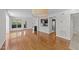 Open-concept living room with hardwood floors, fireplace, and view of the kitchen at 1010 Nicholwood Dr # 301, Raleigh, NC 27605