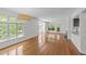 Bright living room with gleaming hardwood floors and ample natural light from large windows at 1010 Nicholwood Dr # 301, Raleigh, NC 27605