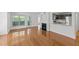 Open-concept living room featuring a fireplace and a kitchen with stainless steel appliances at 1010 Nicholwood Dr # 301, Raleigh, NC 27605