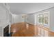 Bright living room features hardwood floors, a fireplace, and lots of natural light from the bay windows at 1010 Nicholwood Dr # 301, Raleigh, NC 27605