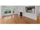 Open-concept living room featuring a fireplace and view into the kitchen at 1010 Nicholwood Dr # 301, Raleigh, NC 27605