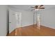 Spacious main bedroom with hardwood floors featuring two closets, ensuite bath, and lots of natural light at 1010 Nicholwood Dr # 301, Raleigh, NC 27605