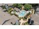 Aerial view of a sparkling swimming pool with sunbathers and a nearby lounge area at 1010 Nicholwood Dr # 301, Raleigh, NC 27605