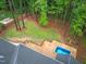 Aerial view of a backyard featuring a wooden deck and in-ground pool, creating a private oasis at 105 Bathgate Ln, Cary, NC 27513
