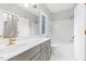 Full bathroom with tub and shower combo, designer sink, and patterned wallpaper at 105 Bathgate Ln, Cary, NC 27513