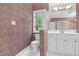 Bathroom features a toilet, sink with white cabinets, and tiled floors at 105 Bathgate Ln, Cary, NC 27513