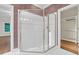 Bathroom features a clear glass shower with a silver frame and a walk-in closet at 105 Bathgate Ln, Cary, NC 27513
