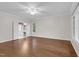 Bright bedroom featuring hardwood flooring, large windows and ceiling fan at 105 Bathgate Ln, Cary, NC 27513