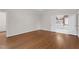 Bright bedroom featuring hardwood flooring, large windows and white trim at 105 Bathgate Ln, Cary, NC 27513