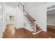 Elegant foyer with hardwood flooring, staircase, and detailed trim work throughout at 105 Bathgate Ln, Cary, NC 27513