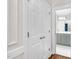 Hallway leading to bathroom with dual closets at 105 Bathgate Ln, Cary, NC 27513
