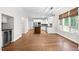 Open layout connecting the kitchen with the island and stainless steel appliances at 105 Bathgate Ln, Cary, NC 27513