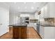 The kitchen features custom cabinetry, stainless steel appliances, and a center island at 105 Bathgate Ln, Cary, NC 27513