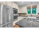 A close up of the kitchen's stainless steel appliances and custom cabinetry at 105 Bathgate Ln, Cary, NC 27513