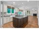 Spacious kitchen with a large island, hardwood floors, and stainless steel appliances at 105 Bathgate Ln, Cary, NC 27513