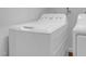 Bright laundry room features a white washing machine with multiple settings and a matching dryer at 105 Bathgate Ln, Cary, NC 27513