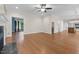 Spacious living room featuring hardwood floors, connecting rooms, and natural light at 105 Bathgate Ln, Cary, NC 27513
