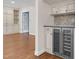 Close up view of custom built-in cabinetry and a drink fridge in the living room at 105 Bathgate Ln, Cary, NC 27513
