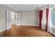 Bright living room with hardwood floors, french doors, and natural light at 105 Bathgate Ln, Cary, NC 27513