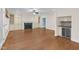 Spacious living room with hardwood floors, built-in cabinets, and a cozy fireplace at 105 Bathgate Ln, Cary, NC 27513