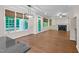 Open living space with hardwood floors, fireplace, and access to the deck and backyard at 105 Bathgate Ln, Cary, NC 27513