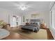 Spacious main bedroom features a ceiling fan, a king bed, and an ensuite bathroom at 105 Bathgate Ln, Cary, NC 27513