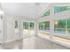 Sunroom with sliding glass door and views of the outdoor deck at 105 Bathgate Ln, Cary, NC 27513
