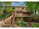 Multi-level backyard deck with stairs, offering ample space for outdoor living and entertaining at 105 Windfall Ct, Cary, NC 27518