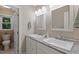 Updated bathroom boasts granite counters, double sinks, modern fixtures, and a view from the window at 105 Windfall Ct, Cary, NC 27518