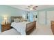 A Primary bedroom featuring neutral colors, two windows, and wood furniture enhancing a calm atmosphere at 105 Windfall Ct, Cary, NC 27518