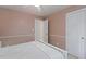 This bedroom features neutral walls, white trim, a ceiling fan, and two closets, offering a clean and simple space at 105 Windfall Ct, Cary, NC 27518