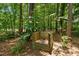 Compost box set amidst a beautiful wooded area, perfect for sustainable gardening and landscaping at 105 Windfall Ct, Cary, NC 27518