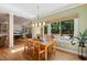 Bright dining area with wood floors and large windows overlooking the outside at 105 Windfall Ct, Cary, NC 27518