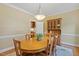 Inviting dining area featuring a wood table, seating for six, and a classic hutch at 105 Windfall Ct, Cary, NC 27518