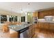 Spacious kitchen with island seating, built-in ovens, and natural light at 105 Windfall Ct, Cary, NC 27518
