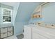 Bright laundry room with washer, dryer, window and storage space, combining functionality with a clean and organized design at 105 Windfall Ct, Cary, NC 27518