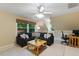 A cozy living room is filled with natural light, modern furniture, and a comfortable seating area, perfect for relaxing at 105 Windfall Ct, Cary, NC 27518