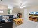 Cozy living room is well-lit with comfortable seating, a TV, and modern decor, creating a welcoming and functional space at 105 Windfall Ct, Cary, NC 27518