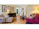 A living room with comfortable seating, neutral walls, and wood floors perfect for relaxation and entertaining at 105 Windfall Ct, Cary, NC 27518