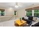 Bright and airy living room with neutral tones, comfortable seating, and large windows, perfect for a relaxing living space at 105 Windfall Ct, Cary, NC 27518