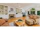 Spacious living room with a fireplace, built-in shelving, and a view of the outside at 105 Windfall Ct, Cary, NC 27518