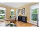 A living room with neutral walls, wood floors, and ample natural light for a serene space at 105 Windfall Ct, Cary, NC 27518