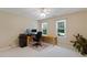 Office features a large window offering an inviting workspace with natural light and a view of the surrounding landscape at 105 Windfall Ct, Cary, NC 27518