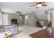 Open bedroom featuring ceiling fans, a seating area, a play area, and neutral walls at 10721 Marabou Ct, Raleigh, NC 27614