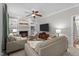 Inviting living room featuring fireplace with built-ins and large television perfect for relaxation at 10721 Marabou Ct, Raleigh, NC 27614