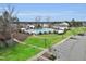 Capture of a large community pool with a pavilion, surrounded by lush landscaping and a walking path at 108 Market Cross Ct, Holly Springs, NC 27540
